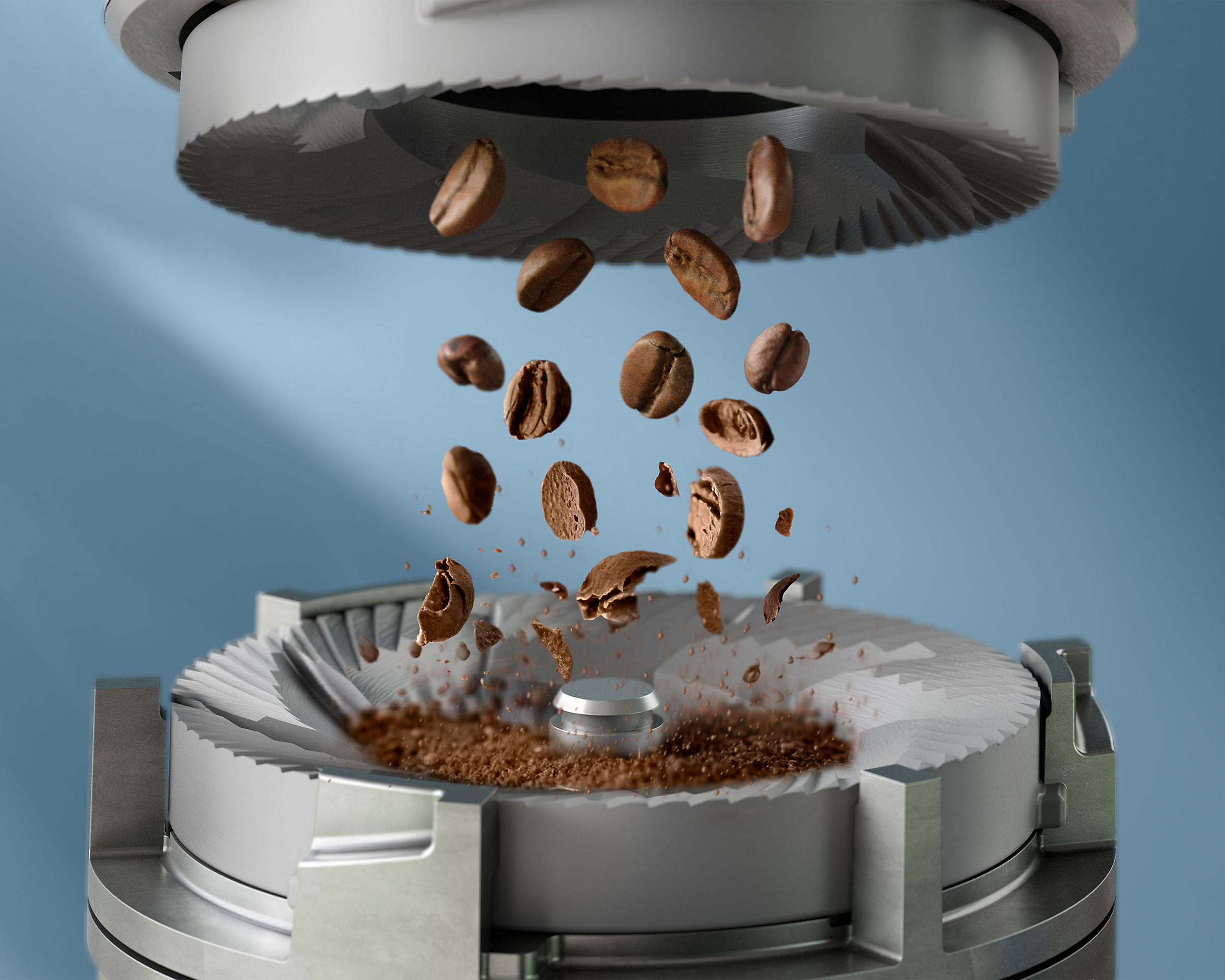 Mlynček na kávu s kávovými zrnami