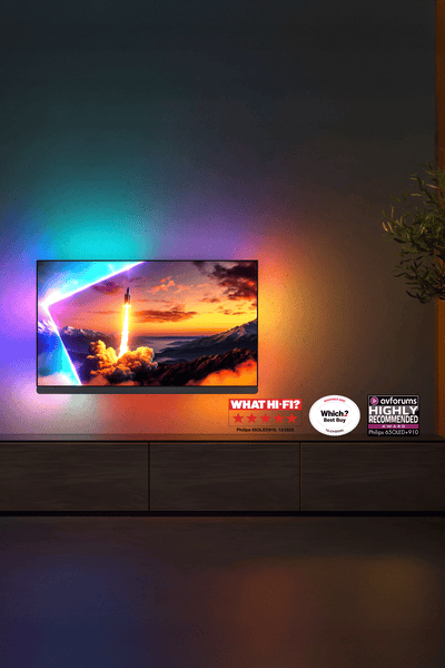 Philips OLED 910 Ambilight TV lighting the wall with vibrant colors in a living room