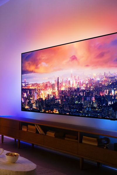 A living room featuring a Philips Ambilight TV