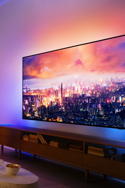 A living room featuring a Philips Ambilight TV