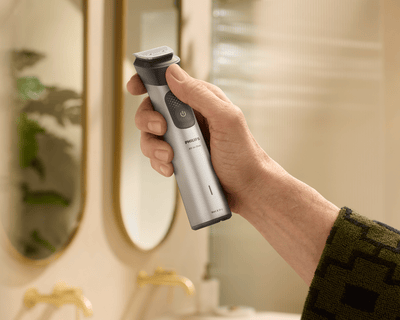 Hand holding cordless All-in-One trimmer