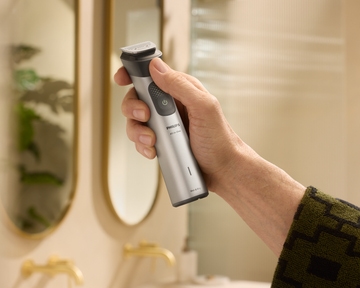 Hand holding cordless All-in-One trimmer