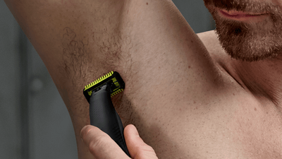 Man shaving armpit with OneBlade Pro