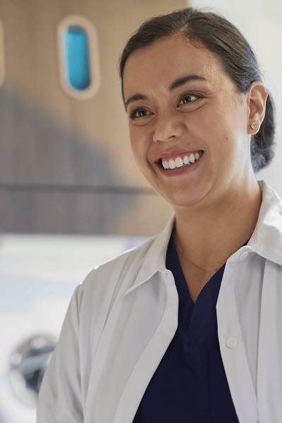 A dental professional speaks to a patient