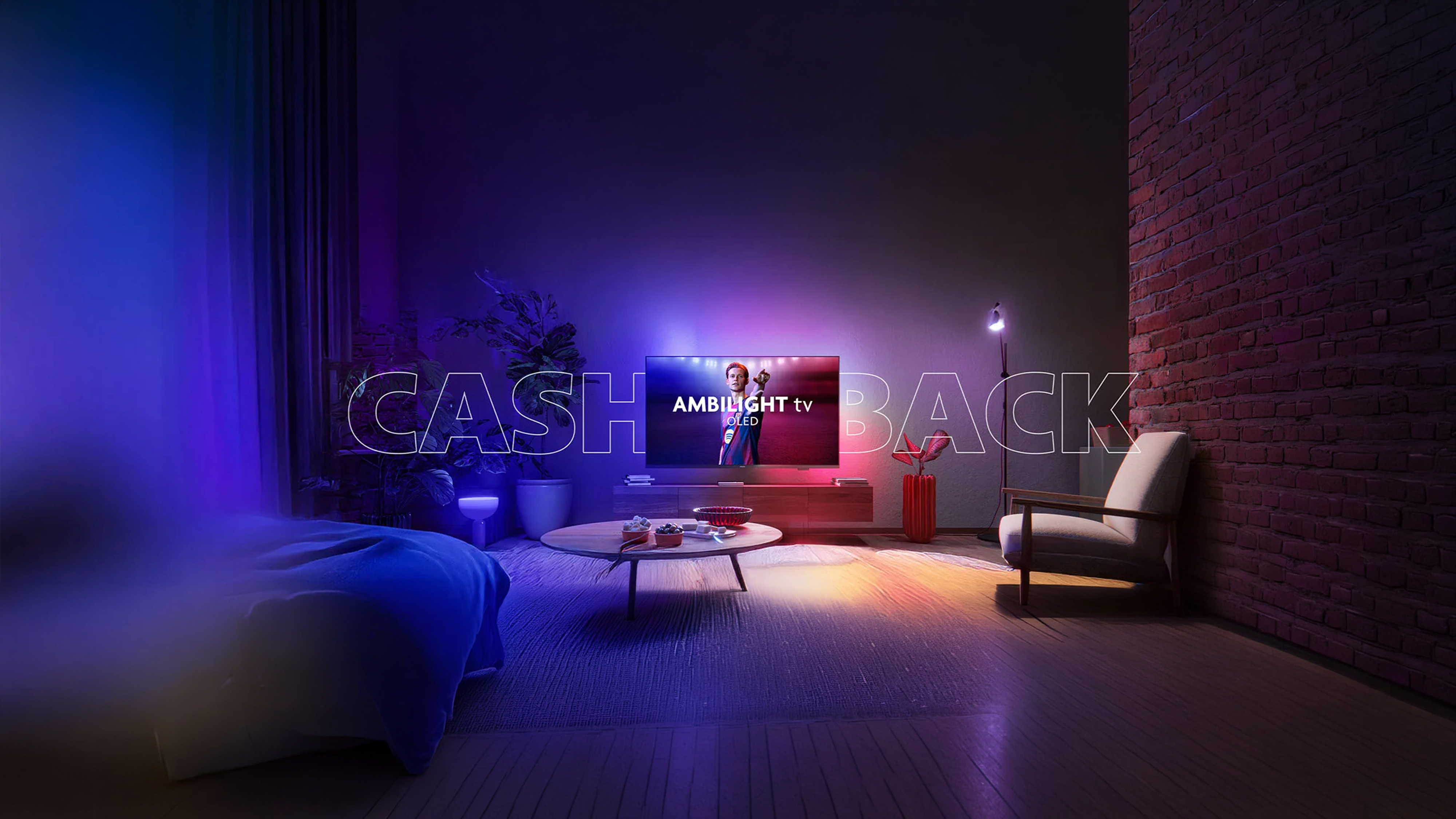 Philips Ambilight TV displaying a football player in a modern living room, with colorful Ambilight effects illuminating the walls and surrounding space.