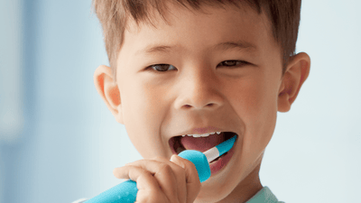 Image of child brushing cleaning teeth
