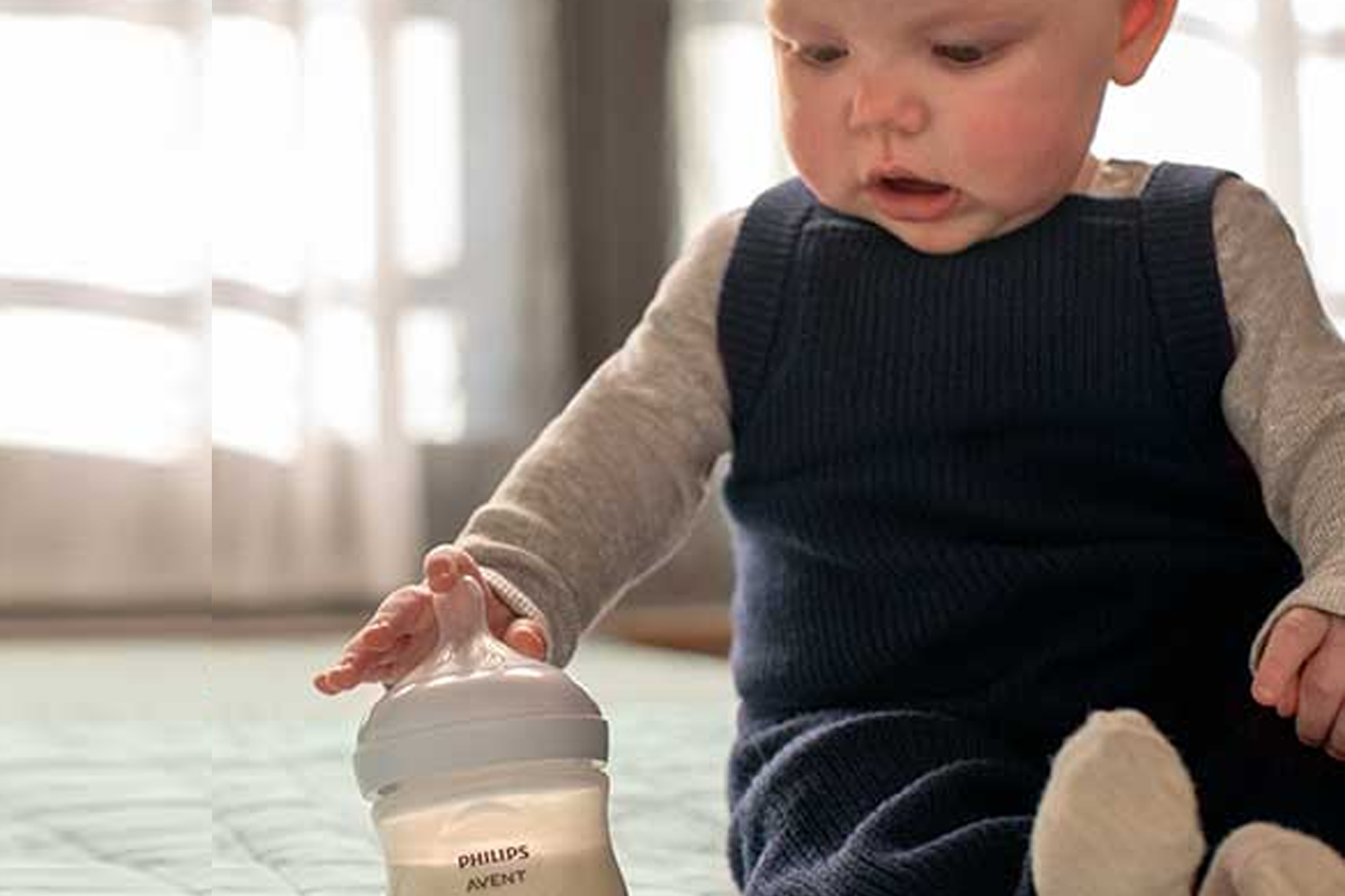 Image of baby with bottle