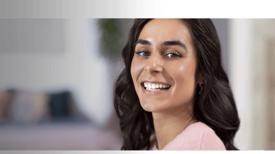 A patient with braces is smiling.