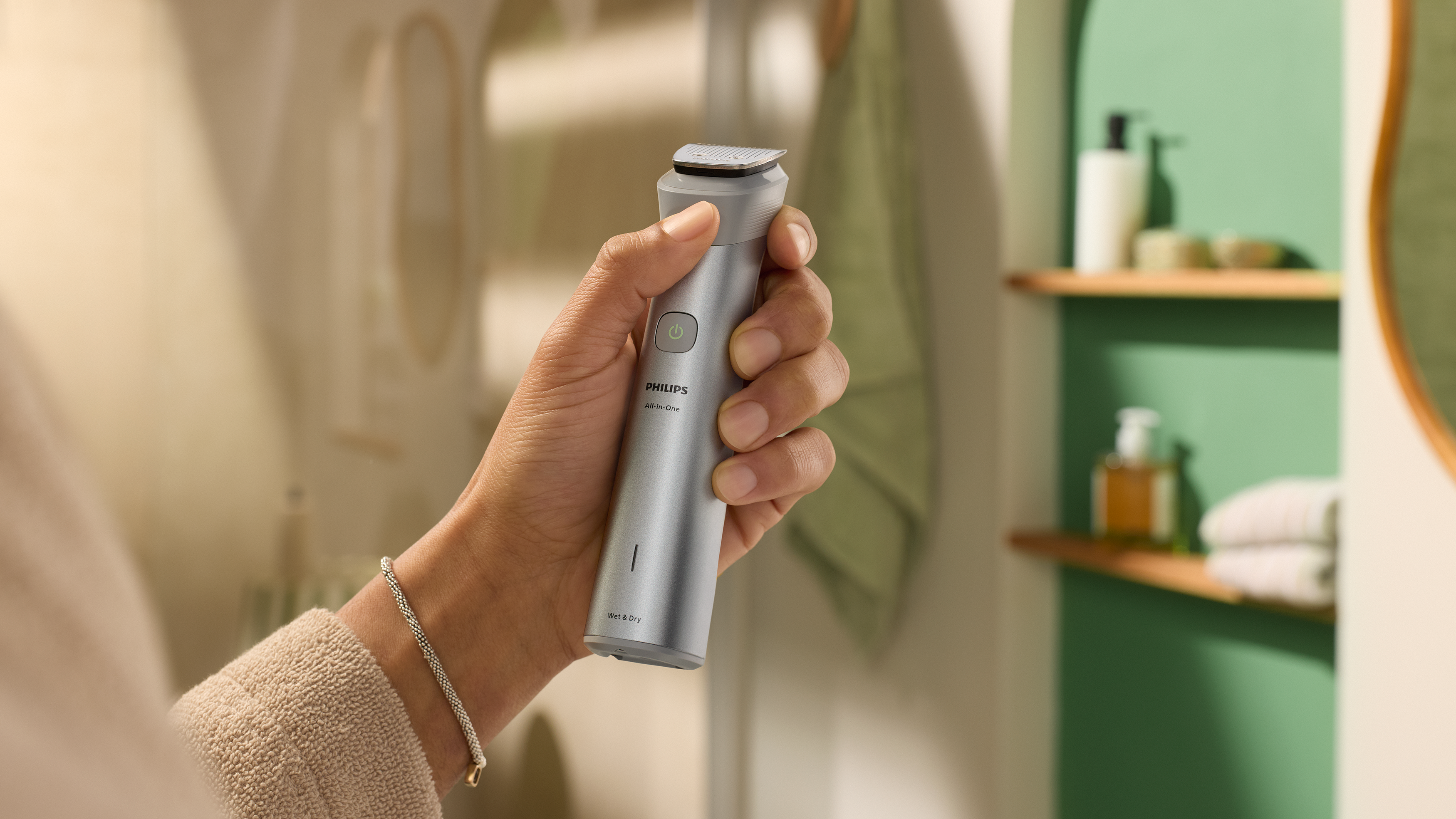 Hand holding cordless All-in-One trimmer