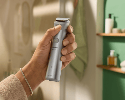 Hand holding cordless All-in-One trimmer