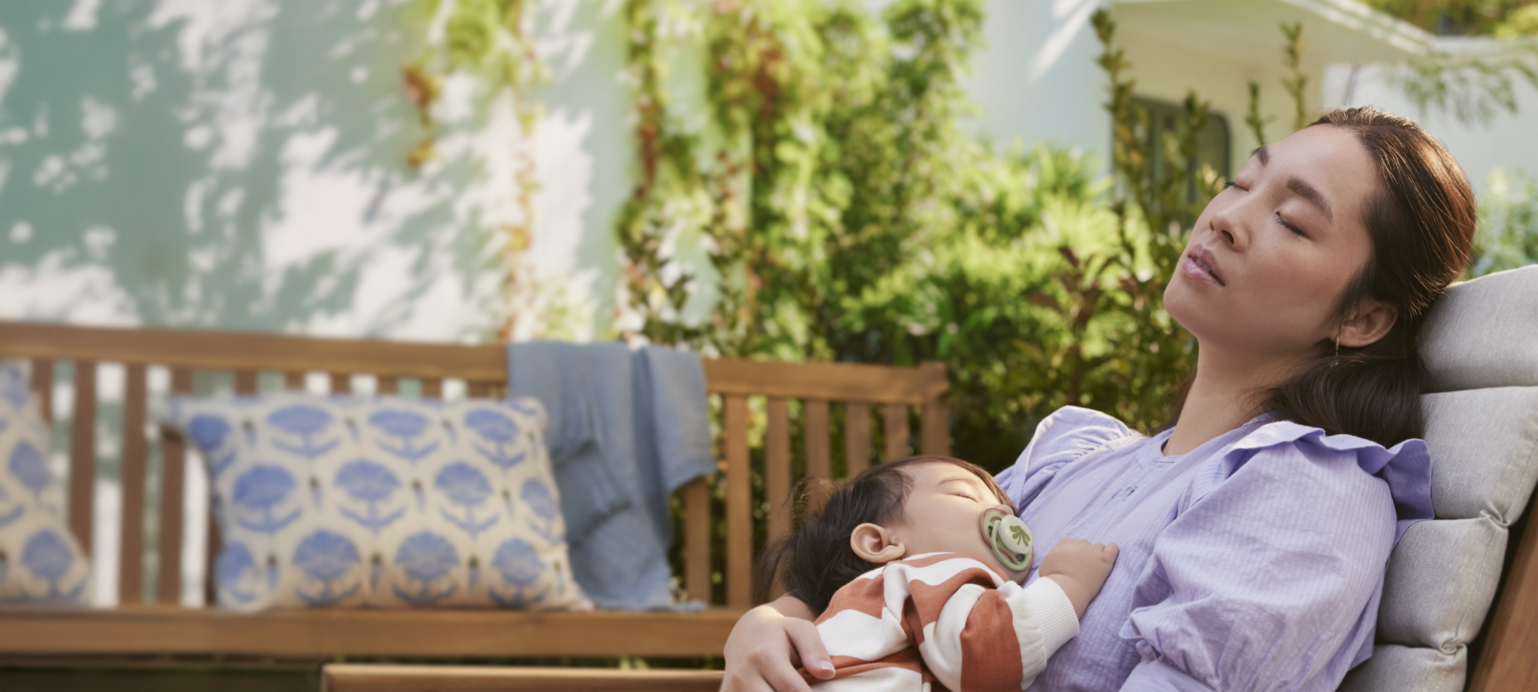 A mother holding his baby