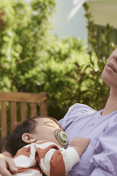A mother holding his baby