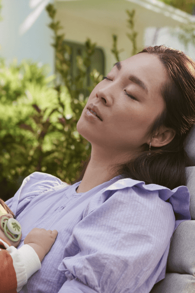 A mother holding his baby