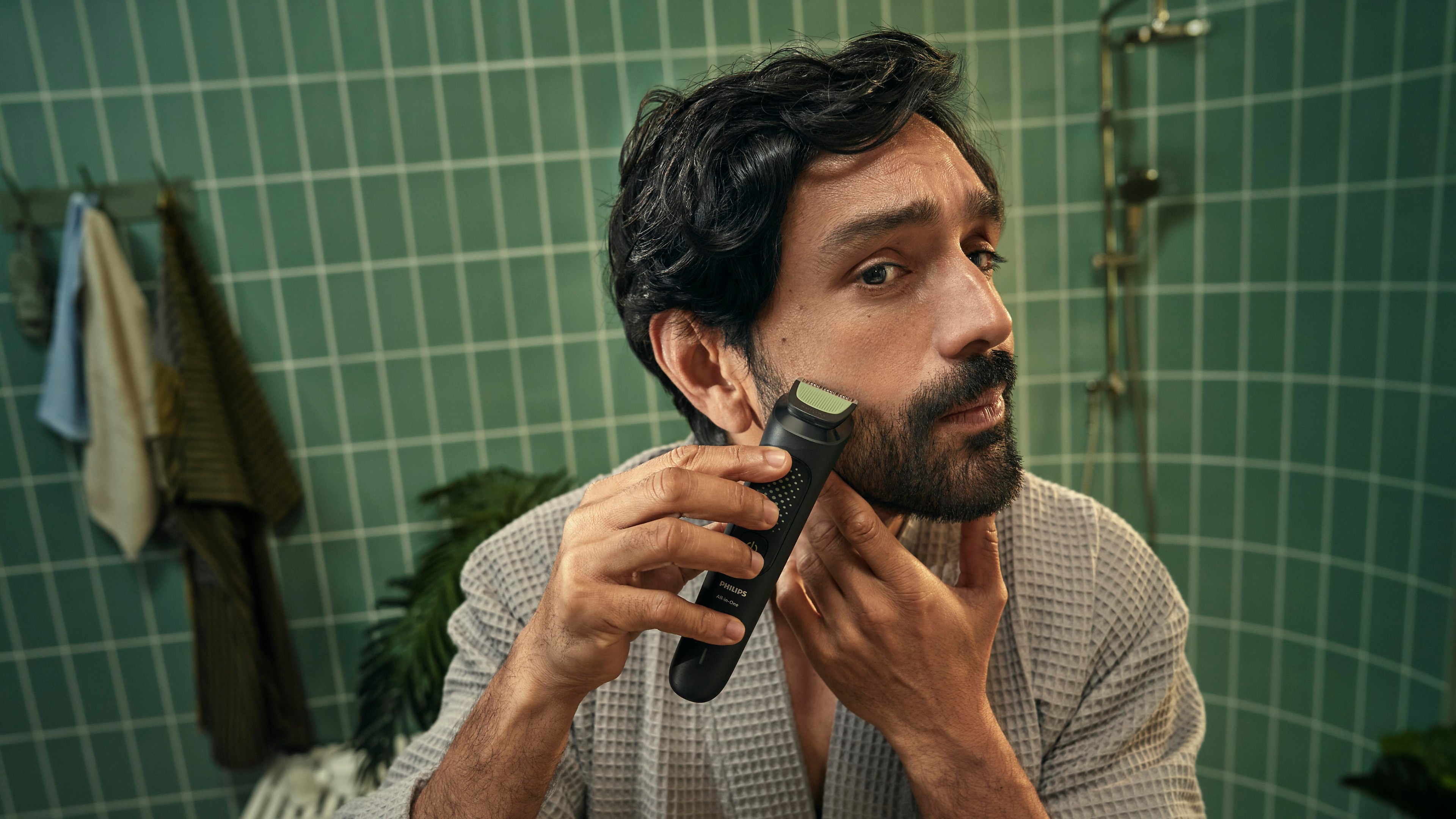 Man shaving beard with Philips All-in-One Trimmer 3000