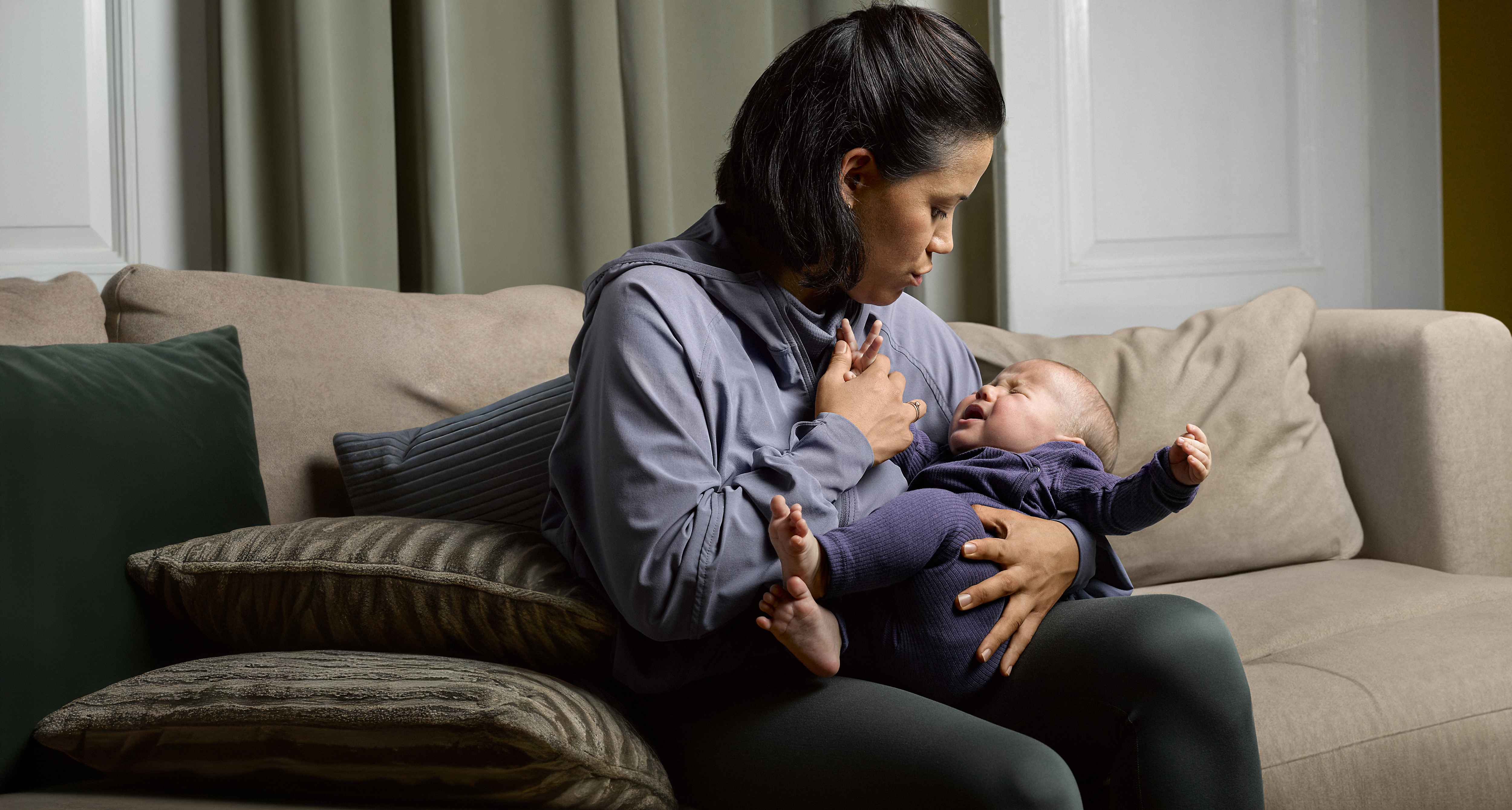 woman comforting a baby