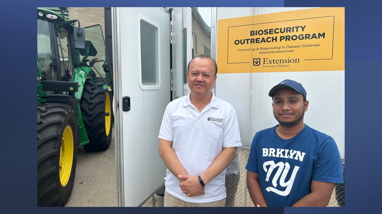 Teng-Teeh Lim on left and Rana Das on right standing in Mizzou outreach trailer