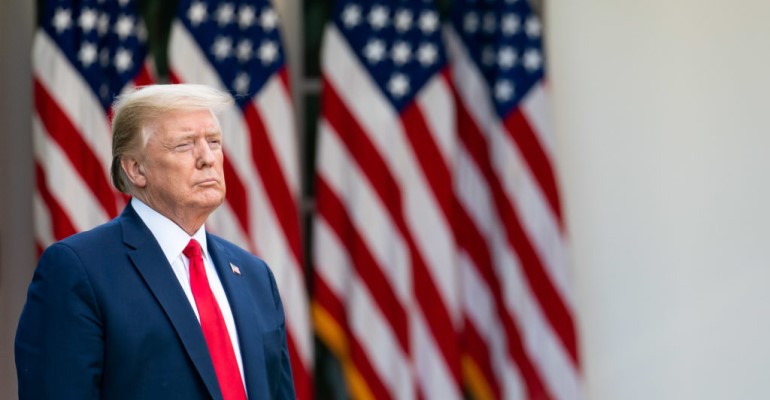 Trump in front of flags.jpg