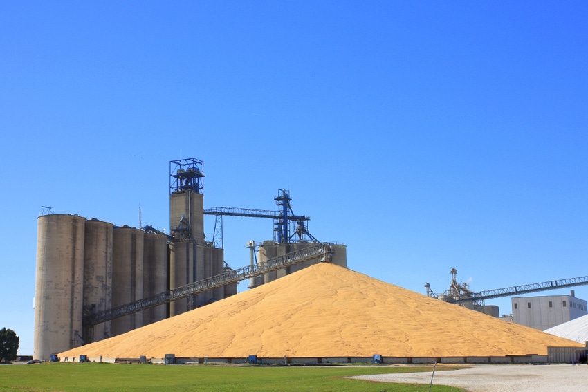 corn pile by grain elevator