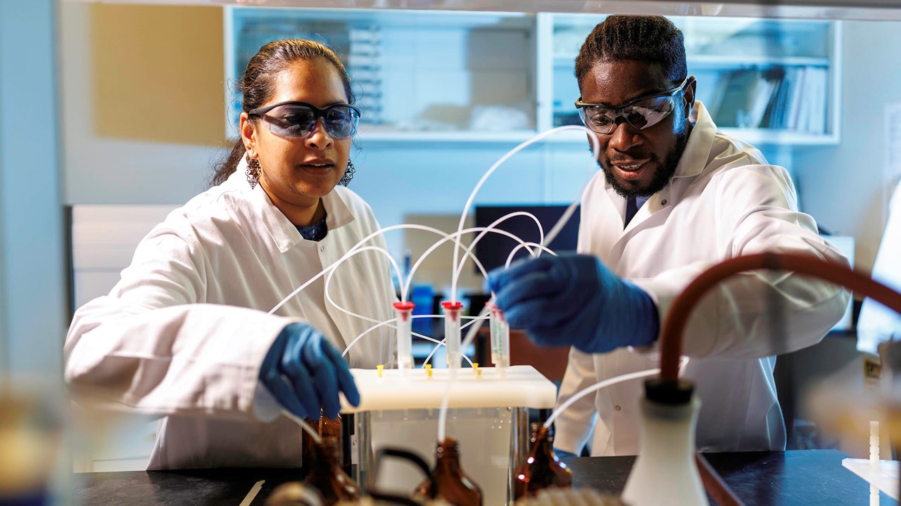 Kiranmayi Mangalgiri, on left, in lab at Oklahoma State University