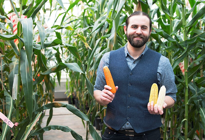 orange corn held by Evan Rocheford, CEO of NutraMaize LLC