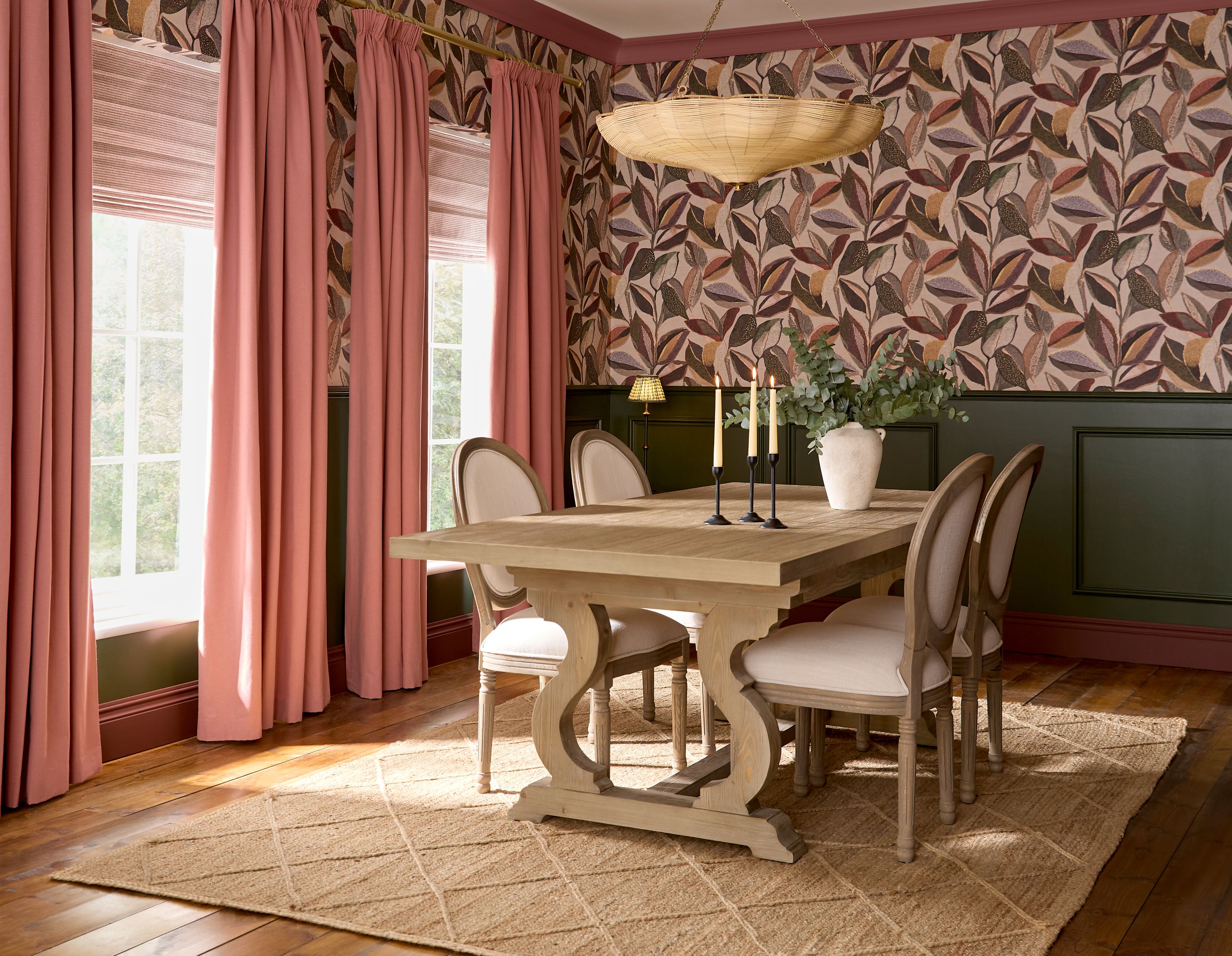 Ardyn Blush Curtains adorning two large vertical windows in a dining room setting with coordinating wallpaper and paint