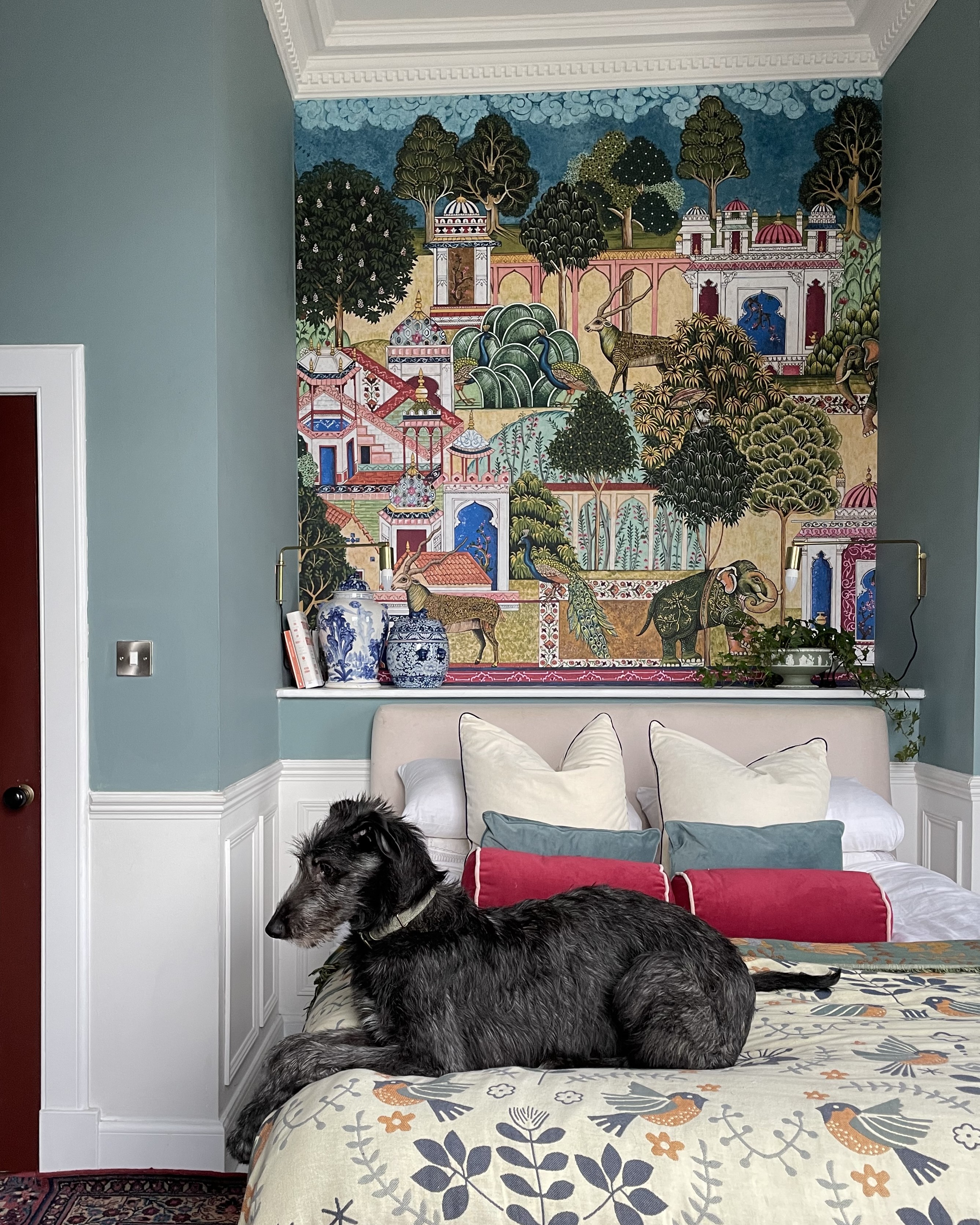 Roomset of childrens room with cot featuring both foundry stripe wallpaper and forge stripe wallpaper