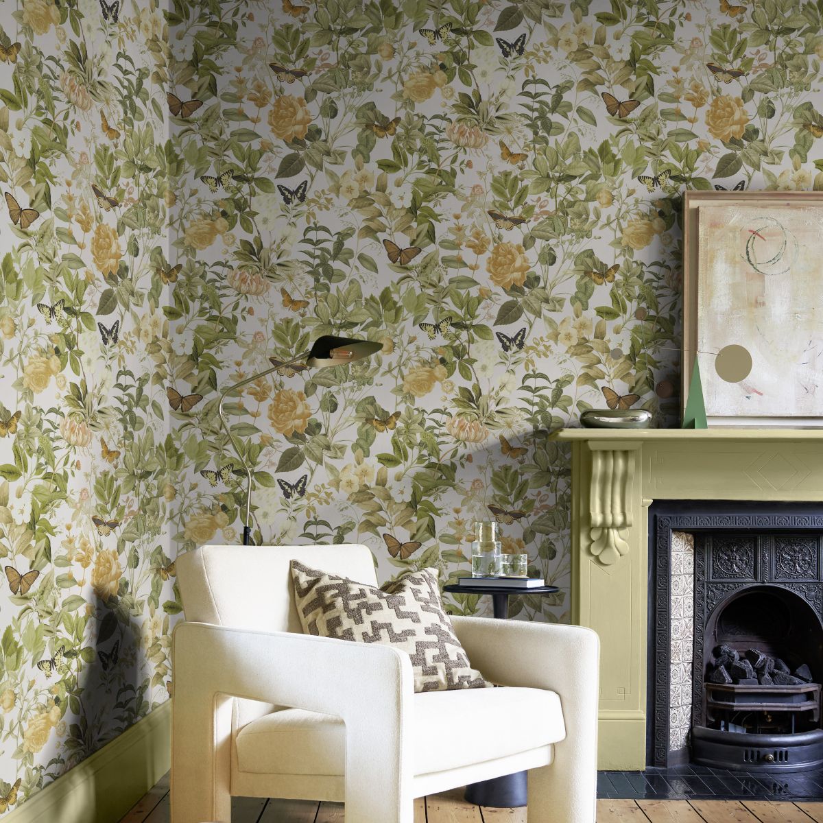 Statement chair positioned next to a fireplace with Bodnant Garden Creme Brulee on the walls