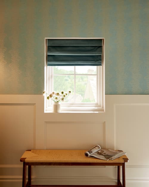 Opulence Spearmint roman blind partnered with Whispering Fern Mist wallpaper in a hallway setting