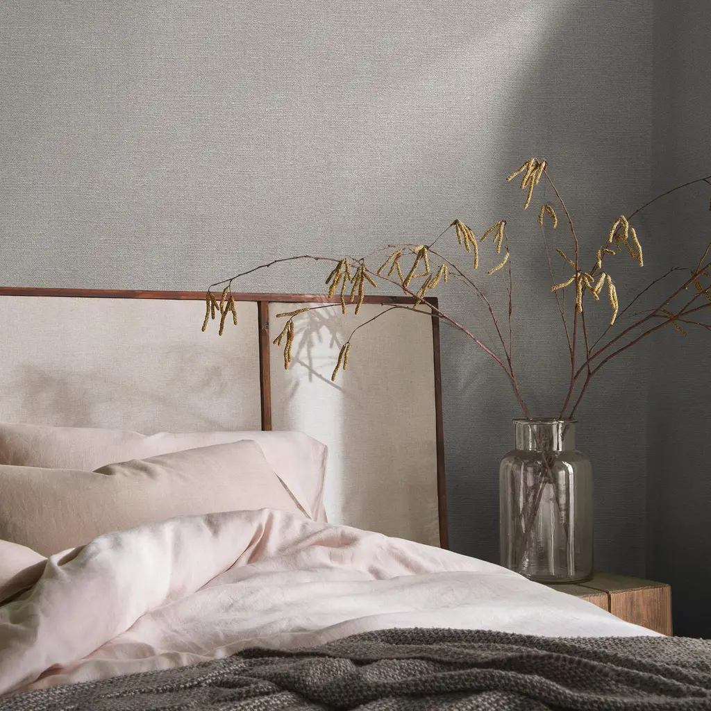 bedroom room set with bed, vase and haptic linen wallpaper