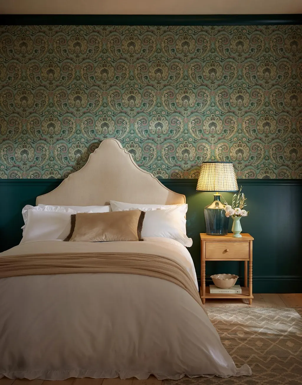 Room set image of bedroom featuring paisley tapestry wallpaper