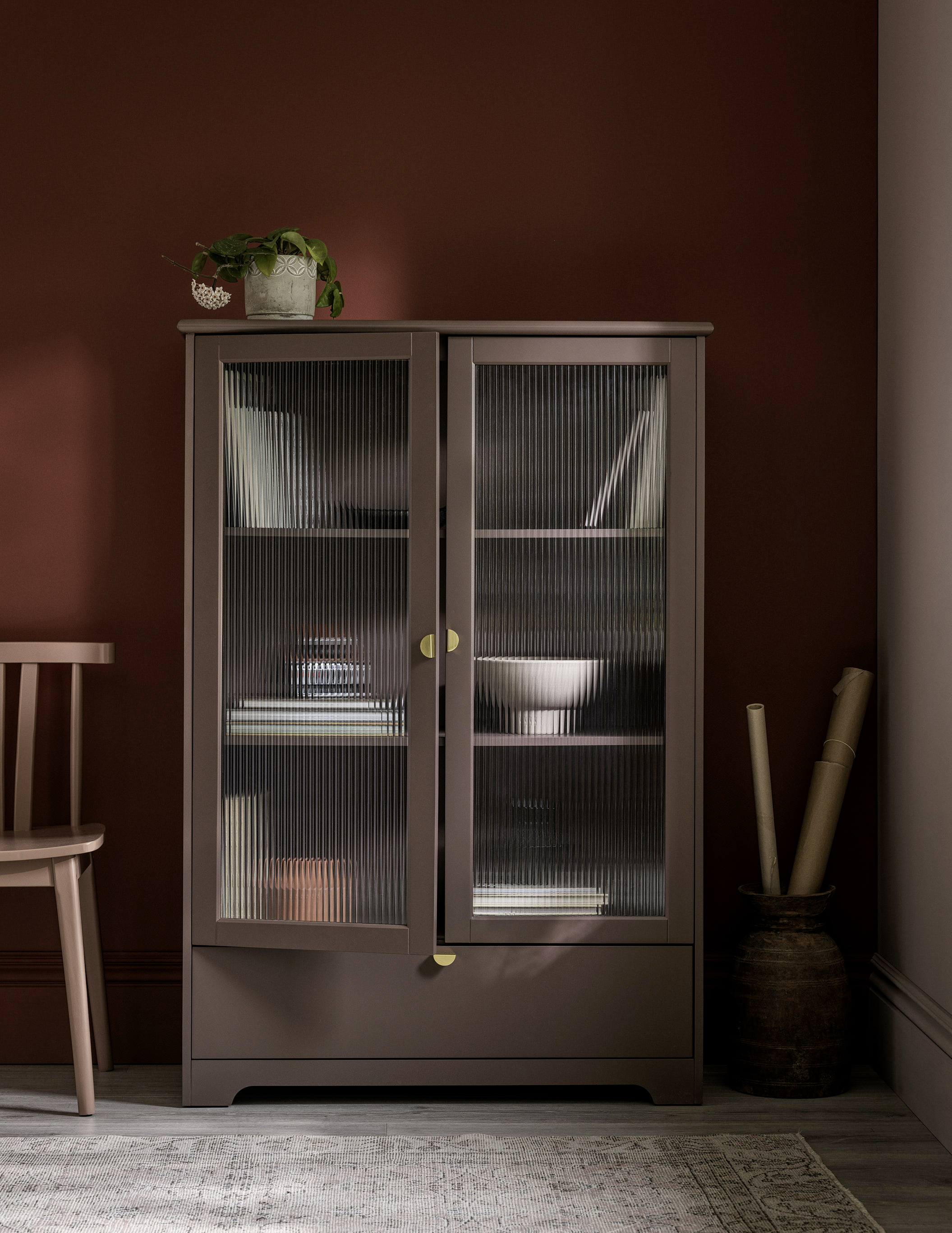 Painted cabinet with pimento painted wall