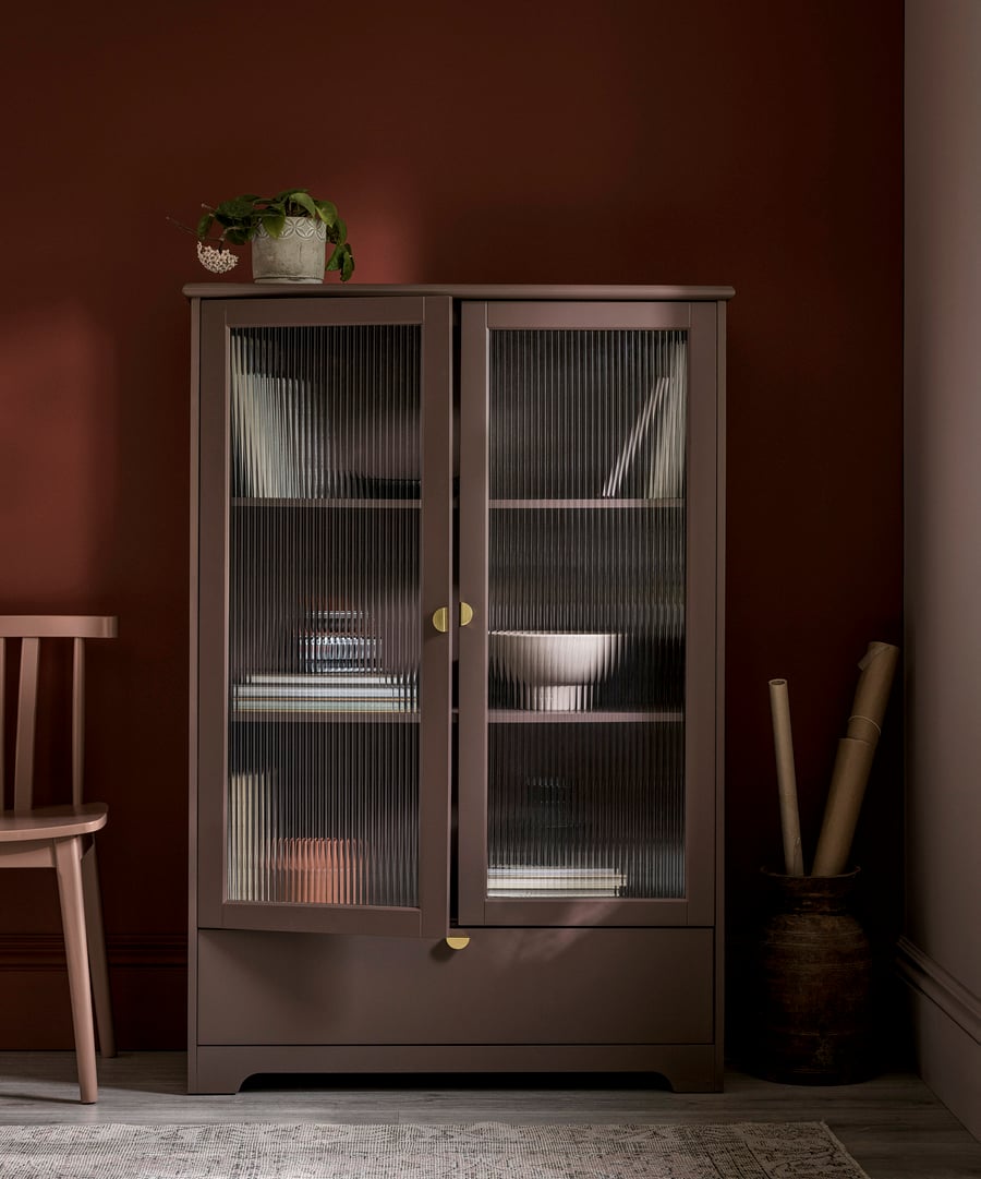 Painted cabinet with pimento painted wall