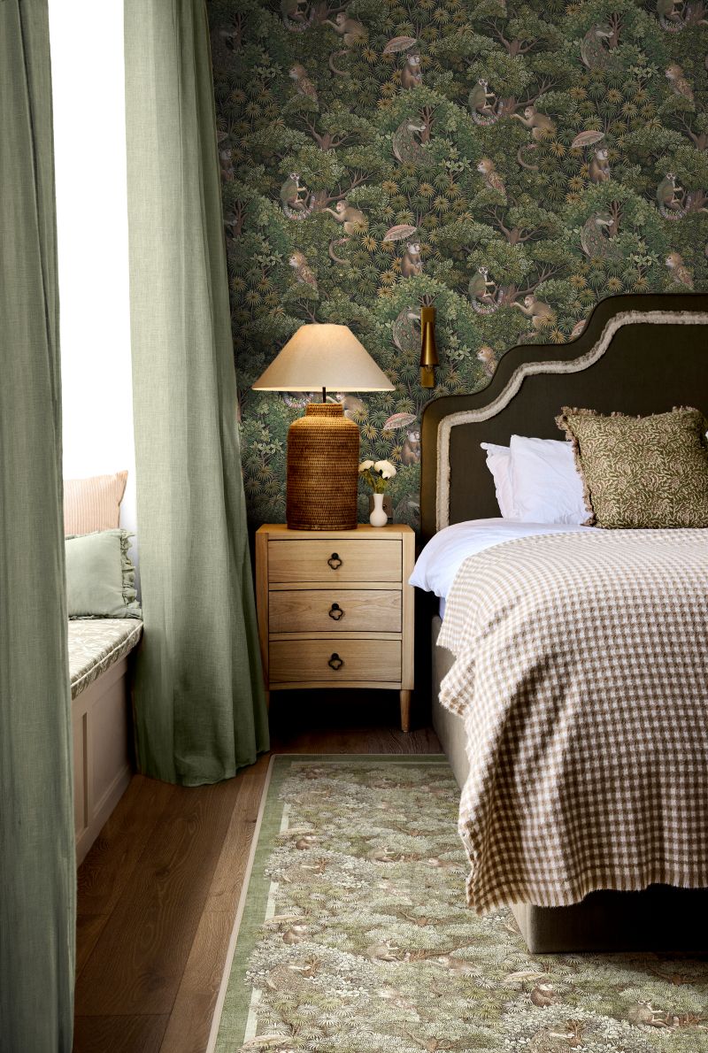 Treeptop Troop Green Rug in a bedroom setting coordinated with Treetop Troop Green Wallpaper