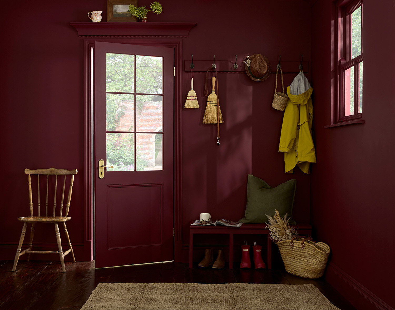 Roomset image of door and boot and coat corner featuring divine damson paint