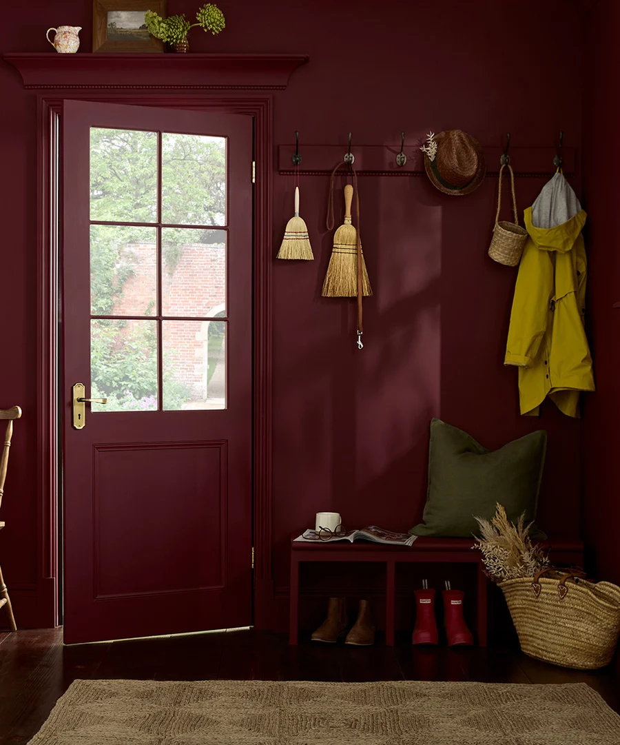 Roomset image of door and boot and coat corner featuring divine damson paint