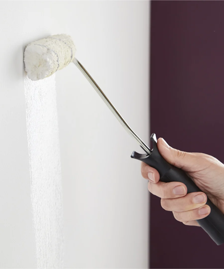 image of someone applying undercoat paint to a wall