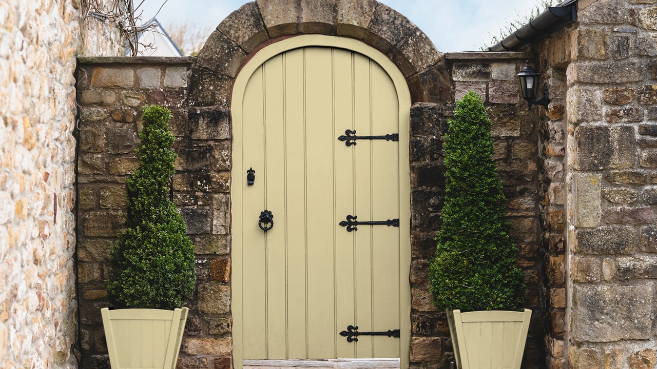 Creme Brulee exterior paint on a garden gate and plant pots