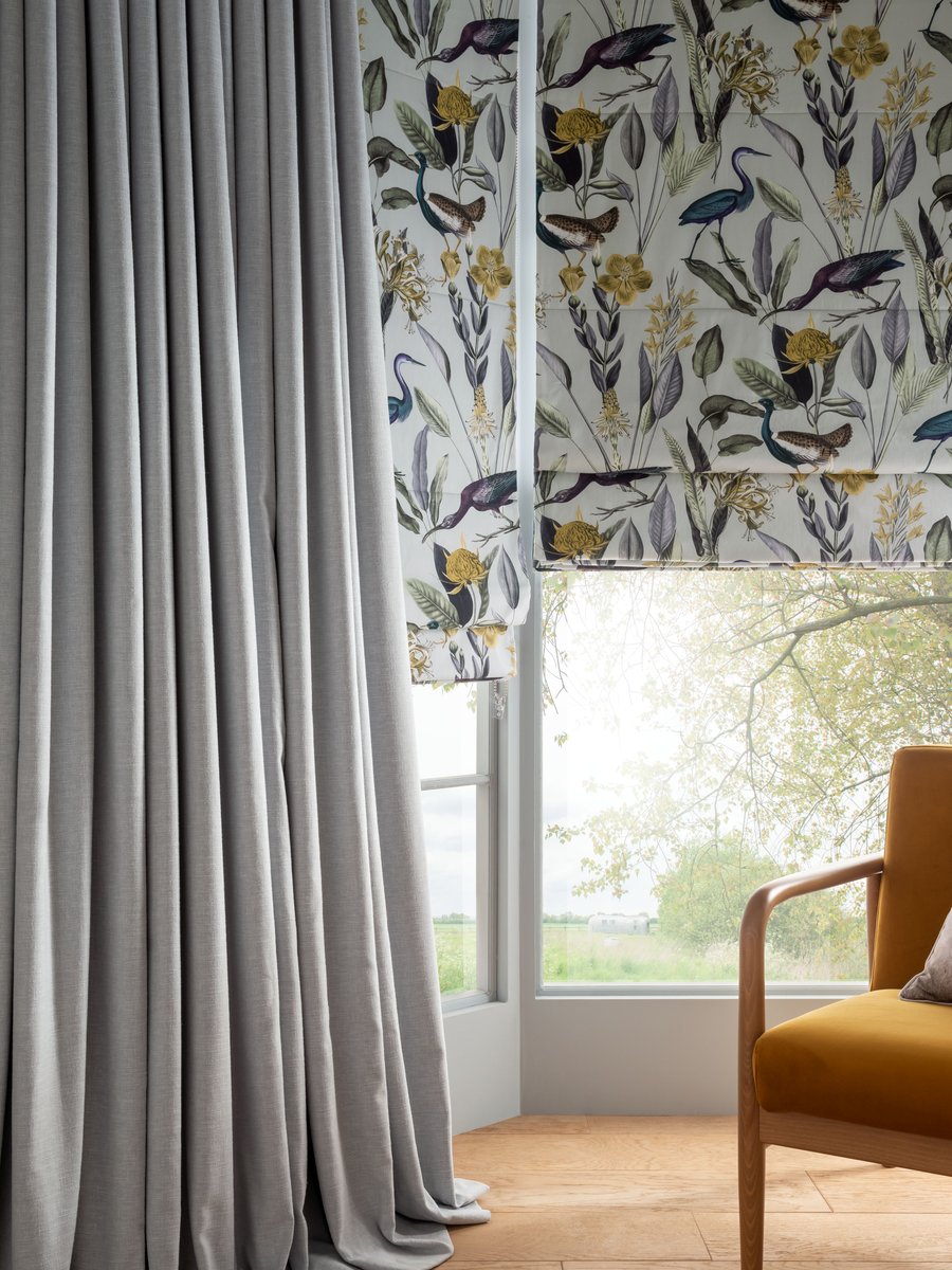 Glasshouse Grey blind and Wallace Grey curtains in living room setting