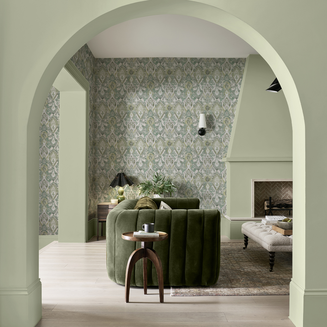 Daraee Tapestry Green wallpaper with Whirl paint in a living room setting