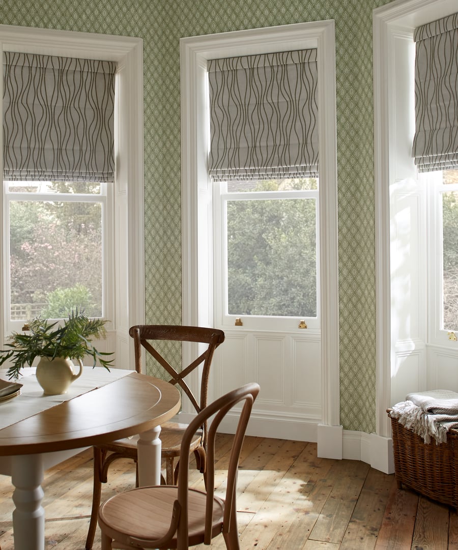 Amara Moss roman blind in a angled bay window