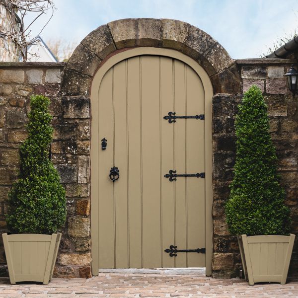 A garden gate with planters paint in Toasted Almond Exterior Paint