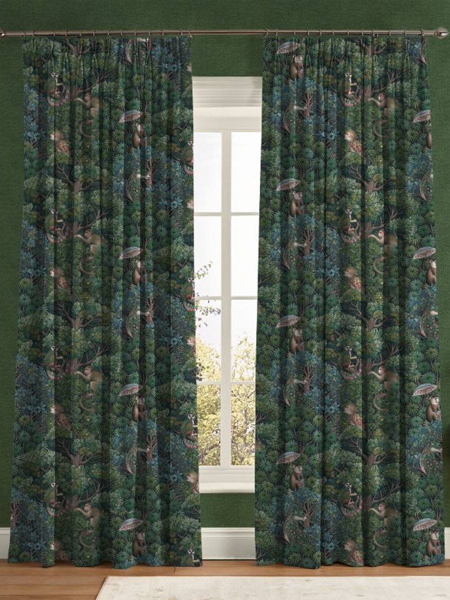 A window dressed with Treetop Troop Green Curtains, with the walls finished in Haptic Green Wallpaper