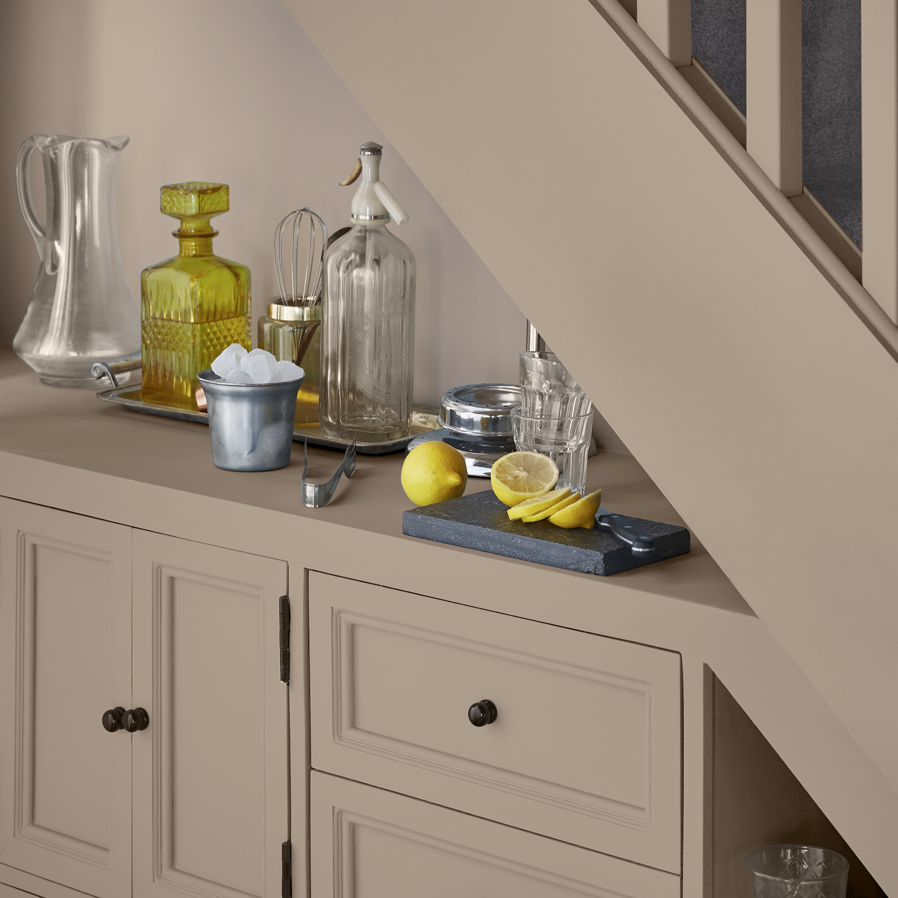 Understairs cupboard storage and staircase with Chesterfield paint. 
