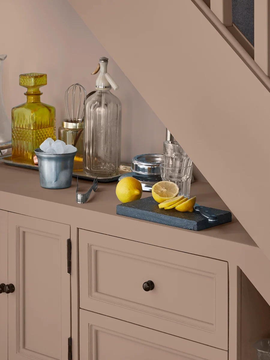 Understairs cupboard storage and staircase with Chesterfield paint.