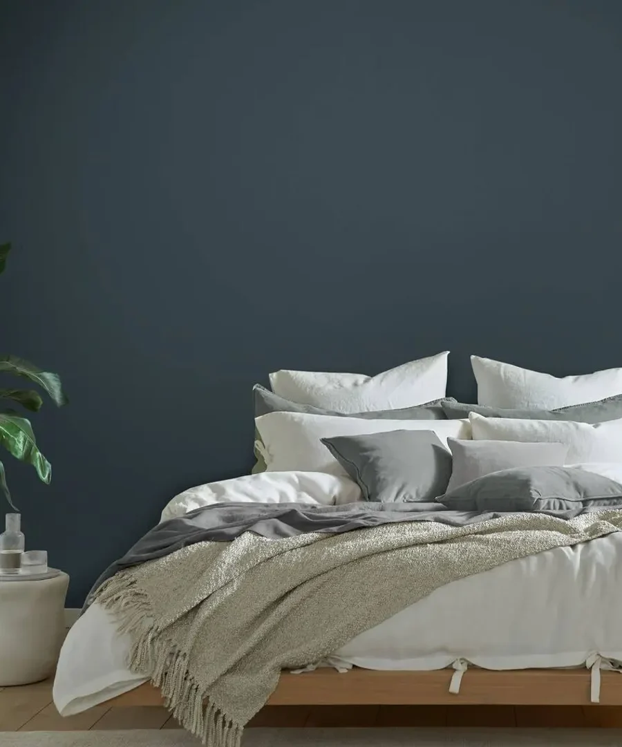 Room set featuring bed and boyfriend jeans paint