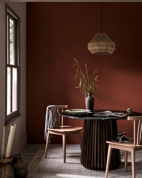 Room set of dining table featuring pimento paint