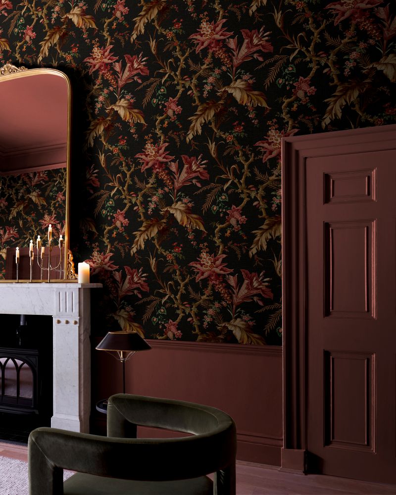Statement chair positioned next to a fireplace with Arbour Press Earth on the walls