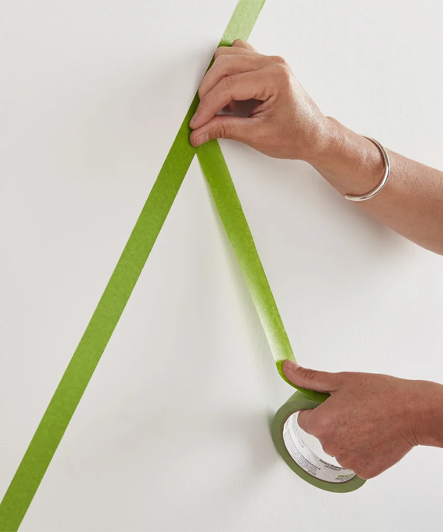 image of someone applying masking tape