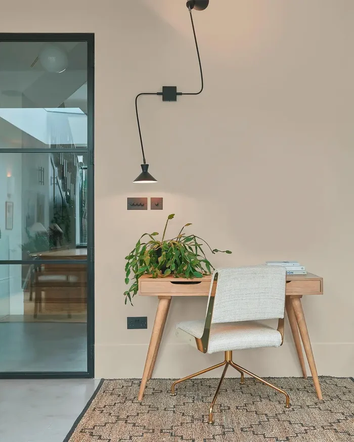 Room set featuring a desk, glass doors and cambridge cream paint