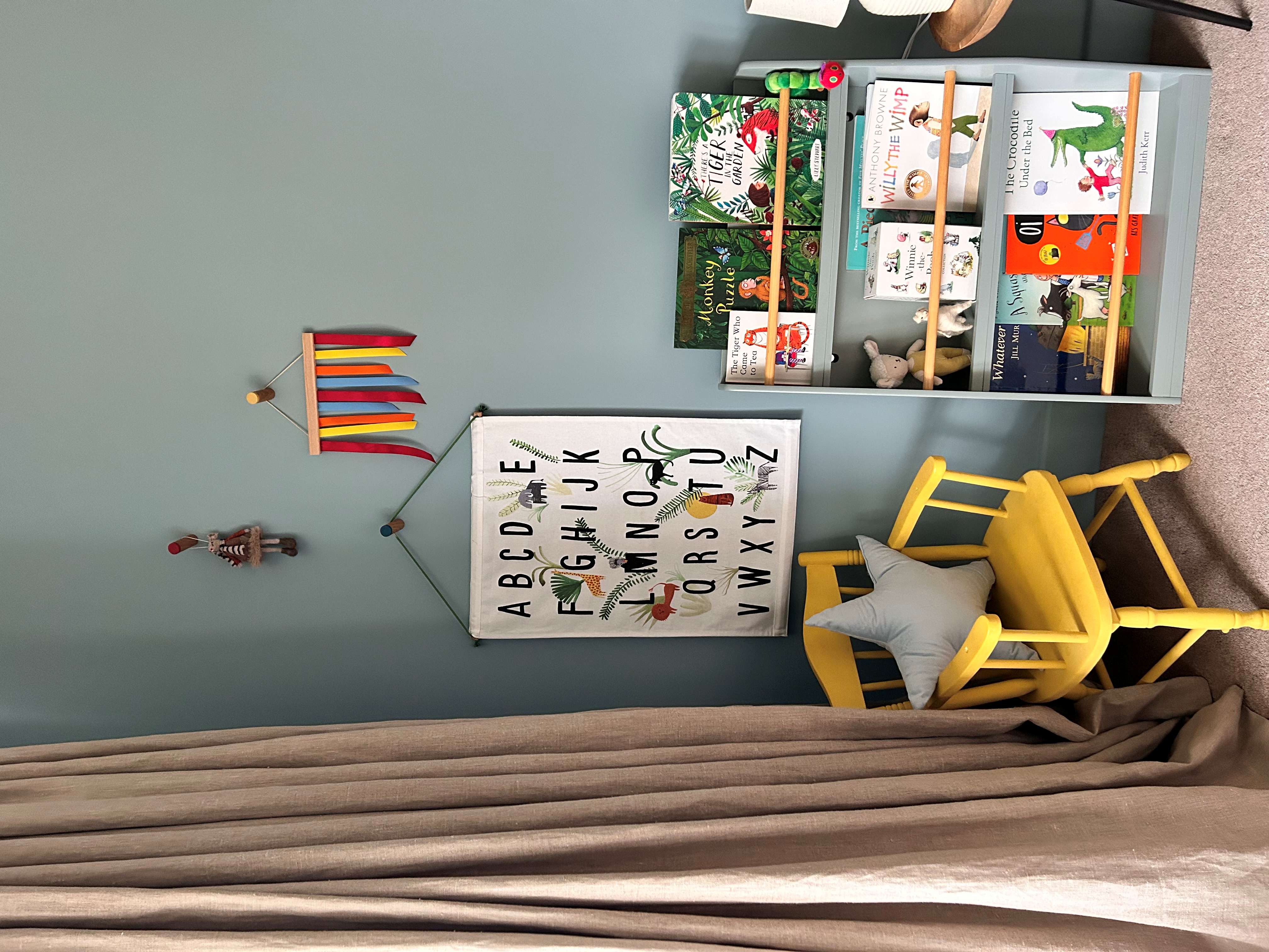 image of childrens room with chair, book shelf and breathe paint